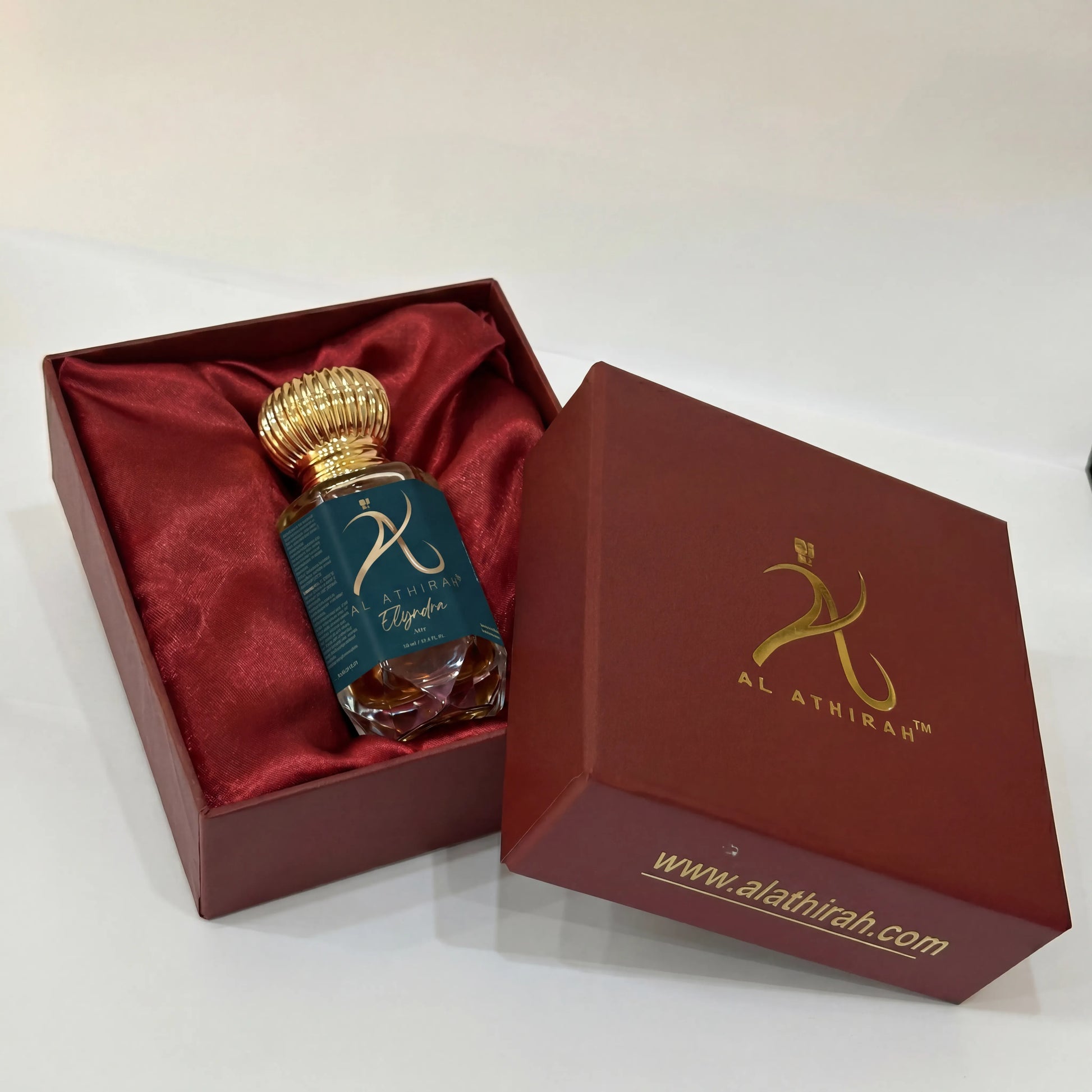 Elyndra Modern Attar for Men and Women in 12ml bottle, non-alcoholic fragrance with a sleek packaging design.