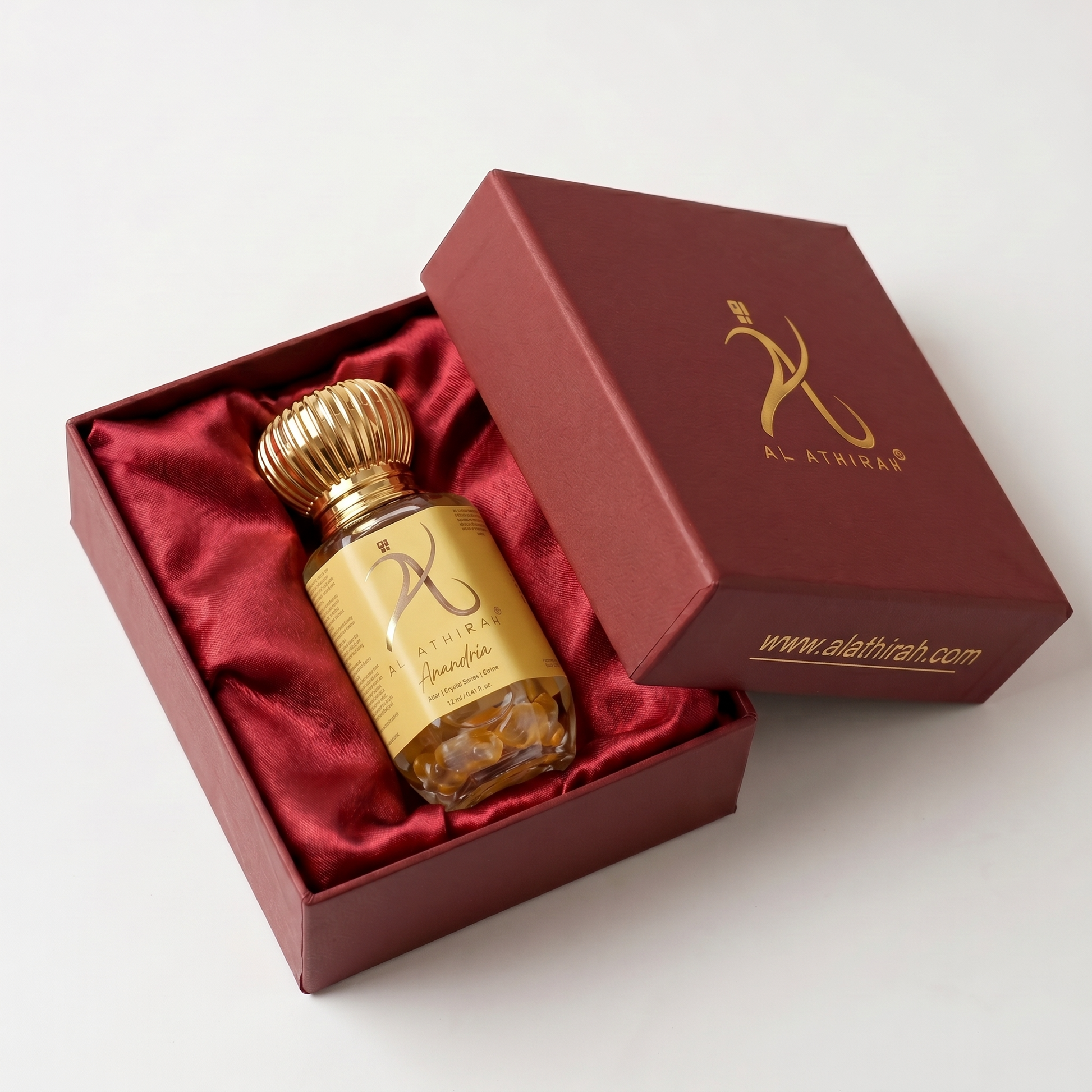 Anandria Crystal Infused Premium Attar bottle with elegant design, showcasing luxurious fragrance packaging.