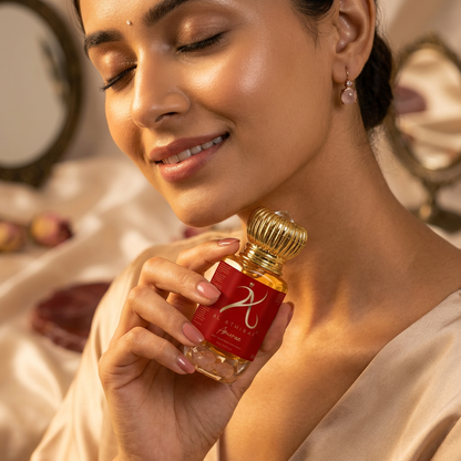 Elegant image of Amoria Crystal Infused Premium Attar in a luxurious bottle with intricate design details.