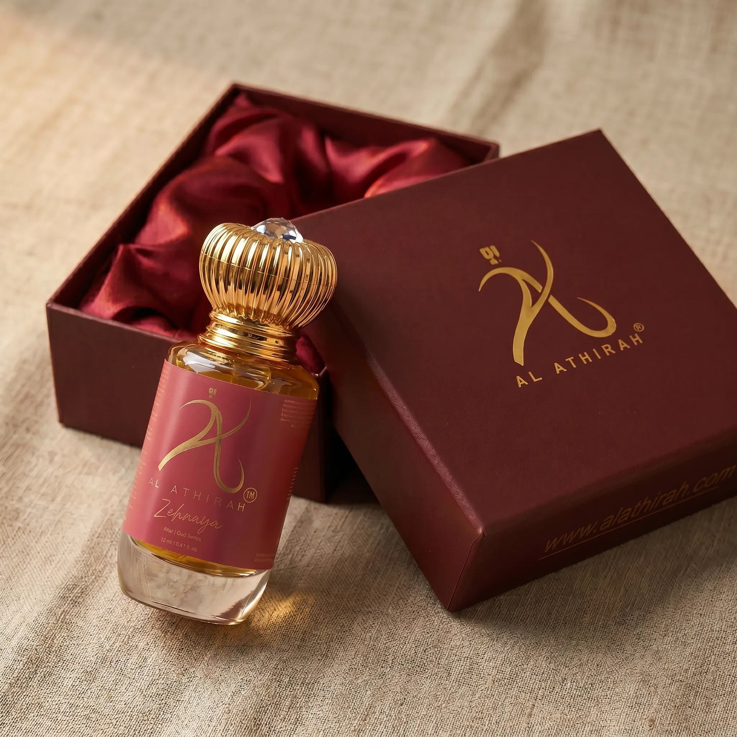 Modern Oud Attar for Women by Zehnaya in a 12ml bottle, non-alcoholic, featuring elegant glass packaging with a sleek design.