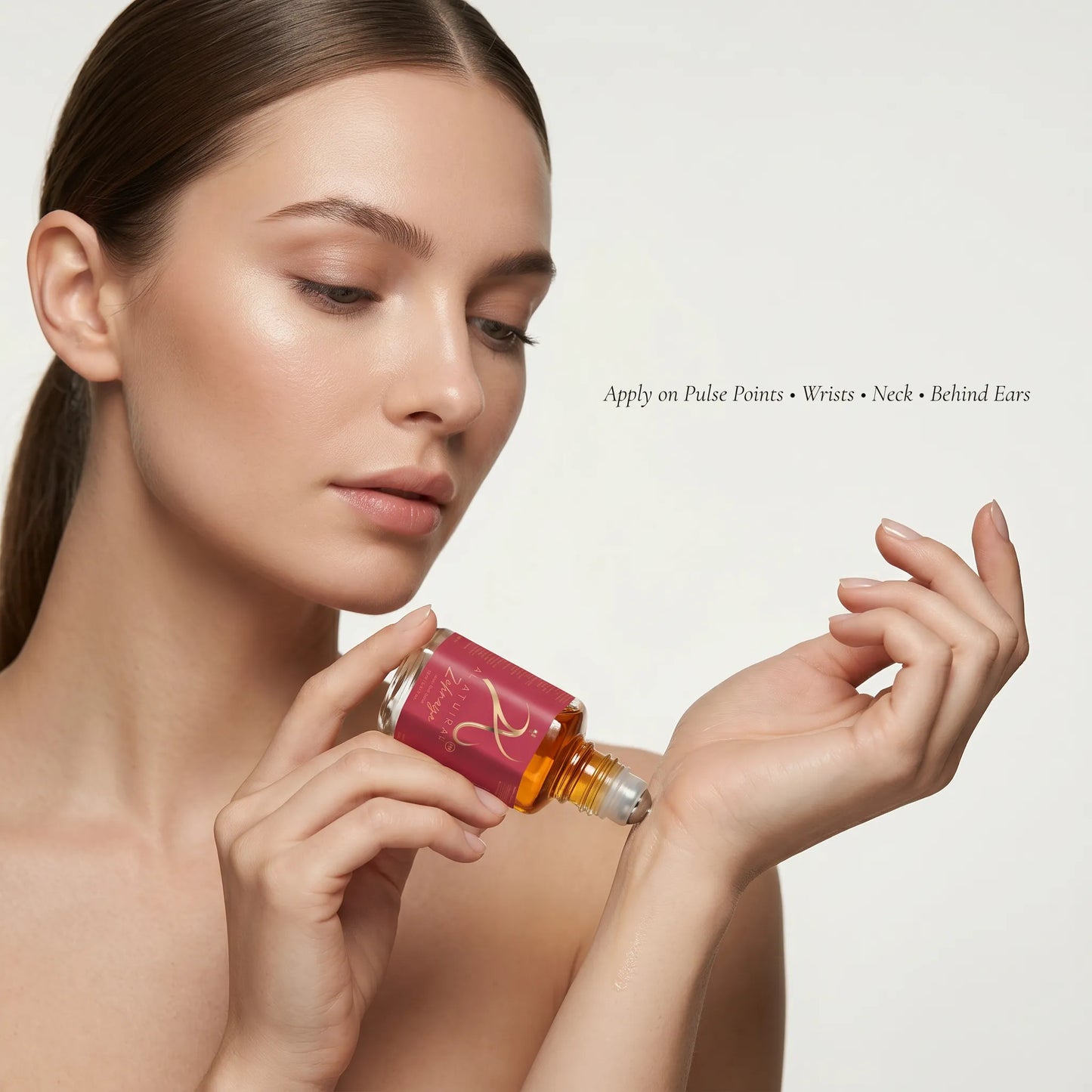 Modern Oud Attar for Women by Zehnaya in a 12ml bottle, featuring a sleek design and luxurious fragrance, non-alcoholic.