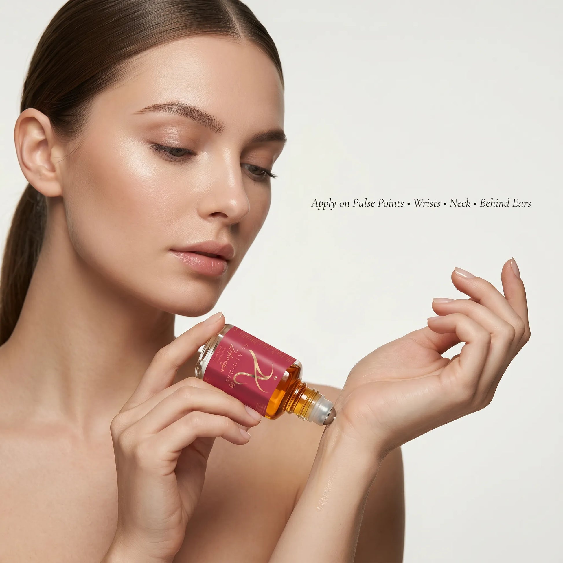 Modern Oud Attar for Women by Zehnaya in a 12ml bottle, featuring a sleek design and luxurious fragrance, non-alcoholic.